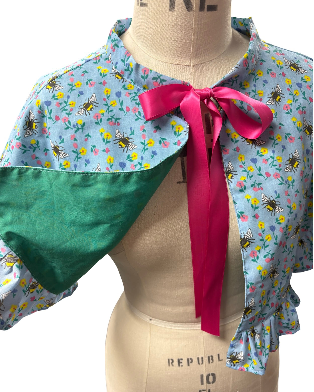 “Miriam” Capelet with ruffle in blue floral and bees